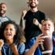 People cheering while watching the Super Bowl